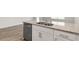 Kitchen island with granite countertop and stainless steel dishwasher at 18 Virgo Dr, Angier, NC 27501