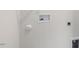Laundry area with utility hookups and shelving at 18 Virgo Dr, Angier, NC 27501