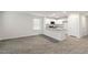 Open concept living room with kitchen and hardwood floors at 18 Virgo Dr, Angier, NC 27501