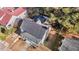 Aerial view showcases the home's roof, landscaping, and neighborhood surroundings at 205 Spring St, Louisburg, NC 27549