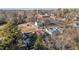 Picturesque aerial capture of a residential community featuring a church and tree-filled landscapes at 205 Spring St, Louisburg, NC 27549