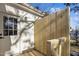 Newly constructed back deck leads to a door with glass panels, adding privacy and charm to the outdoor space at 205 Spring St, Louisburg, NC 27549