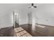 Bright and airy bedroom featuring hardwood floors, and a modern ceiling fan at 205 Spring St, Louisburg, NC 27549