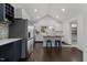 Spacious kitchen with white cabinets, stainless steel appliances, butcher block island, and vaulted ceilings at 205 Spring St, Louisburg, NC 27549