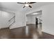 Bright and airy living room with hardwood floors, neutral walls, and an open layout to the kitchen at 205 Spring St, Louisburg, NC 27549