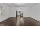 Open-concept living room flows into the kitchen, with hardwood floors and natural light at 205 Spring St, Louisburg, NC 27549