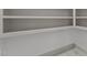 Spacious pantry with ample shelving to keep your kitchen organized and clutter-free at 205 Spring St, Louisburg, NC 27549