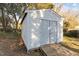Exterior view of the shed with double doors, offering ample storage space and easy access for all your needs at 205 Spring St, Louisburg, NC 27549