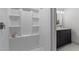 Bright walk-in shower adjacent to the vanity at 205 Spring St, Louisburg, NC 27549