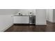 Stylish wet bar with modern cabinets, a beverage cooler, and a dark countertop at 205 Spring St, Louisburg, NC 27549