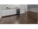 Stylish wet bar with modern cabinets, a beverage cooler, and a dark countertop at 205 Spring St, Louisburg, NC 27549