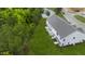 Aerial view of townhouses, showcasing private rear yards and wooded surroundings at 22 Virgo Dr, Angier, NC 27501
