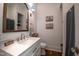 Clean and bright bathroom featuring a modern vanity, mirror, and decor at 223 N Main St, Wendell, NC 27591