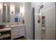 Stylish bathroom featuring modern fixtures, marble vanity, and a glass shower at 223 N Main St, Wendell, NC 27591