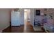 Bedroom featuring a neutral paint scheme, hardwood floors, and decorative accents at 223 N Main St, Wendell, NC 27591