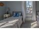 Bright bedroom with hardwood floors, natural light, and calming neutral paint at 223 N Main St, Wendell, NC 27591