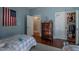 Bedroom with closet, hardwood floors, and classic, painted wood trim at 223 N Main St, Wendell, NC 27591