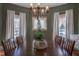 Formal dining room with wood table, chairs and decorative chandelier at 223 N Main St, Wendell, NC 27591