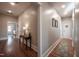 Hallway featuring hardwood floors, recessed lighting, table and doorways at 223 N Main St, Wendell, NC 27591