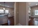 Hallway view of kitchen with island and entryway with decorative table at 223 N Main St, Wendell, NC 27591