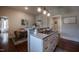 Kitchen island with countertop range and seating overlooking dining area at 223 N Main St, Wendell, NC 27591