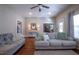 Bright living room featuring neutral furniture, hardwood floors, and recessed lighting at 223 N Main St, Wendell, NC 27591