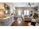 Open-concept living room with hardwood floors, console table, and comfortable seating at 223 N Main St, Wendell, NC 27591