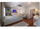 Spacious living room features a decorative fireplace, ceiling fan and hardwood floors at 223 N Main St, Wendell, NC 27591