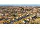 Aerial view of neighborhood with houses and trees at 241 Fair Oaks Ct, Mebane, NC 27302