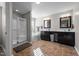 Bathroom with a tiled floor, double sinks, and a separate shower and tub at 241 Fair Oaks Ct, Mebane, NC 27302
