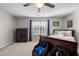 Comfortable bedroom with natural light and neutral paint, as well as a ceiling fan at 241 Fair Oaks Ct, Mebane, NC 27302