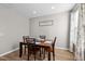 Cozy dining area with wood table and four chairs, near a sunny window at 241 Fair Oaks Ct, Mebane, NC 27302