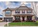 Charming two-story home with a landscaped front yard and a two-car garage at 241 Fair Oaks Ct, Mebane, NC 27302