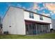 Exterior view of the house featuring a well-kept lawn and enclosed porch at 241 Fair Oaks Ct, Mebane, NC 27302