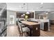 Modern kitchen with island, stainless steel appliances, and granite countertops at 241 Fair Oaks Ct, Mebane, NC 27302