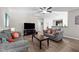 Open living area with gray sofas, wood coffee table, and view to the kitchen at 241 Fair Oaks Ct, Mebane, NC 27302