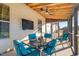 Outdoor screened porch with seating area and ceiling fan at 241 Fair Oaks Ct, Mebane, NC 27302
