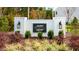 Community entrance sign with landscaping and elegant lighting at 28 Virgo Dr, Angier, NC 27501