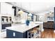 Island kitchen with white cabinets, double ovens, and breakfast bar at 2928 Thurman Dairy, Wake Forest, NC 27587