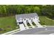 Aerial view showcasing townhouses, landscaping, and parking at 30 Virgo Dr, Angier, NC 27501