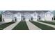 New townhouses with attached garages and well-manicured lawns at 30 Virgo Dr, Angier, NC 27501