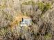 Aerial view of a single-Gathering home nestled in a wooded area at 341 Harts Creek Dr Dr, Pittsboro, NC 27312