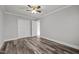Well-lit bedroom with wood-look floors and double closets at 341 Harts Creek Dr Dr, Pittsboro, NC 27312