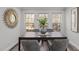 Bright dining room with large windows and a modern table at 341 Harts Creek Dr Dr, Pittsboro, NC 27312