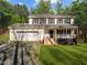 Two-story white house with attached garage and porch at 341 Harts Creek Dr Dr, Pittsboro, NC 27312