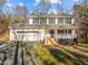 Two-story house with white siding, covered porch, and attached garage at 341 Harts Creek Dr Dr, Pittsboro, NC 27312