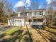 Two-story house with white siding, covered porch, and attached garage at 341 Harts Creek Dr Dr, Pittsboro, NC 27312