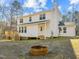 Rear view of the house with deck and firepit at 341 Harts Creek Dr Dr, Pittsboro, NC 27312