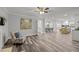 Open living room with hardwood floors and view into kitchen at 341 Harts Creek Dr Dr, Pittsboro, NC 27312