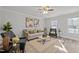 Living room with neutral walls, comfy seating, and large windows at 341 Harts Creek Dr Dr, Pittsboro, NC 27312